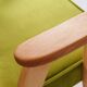 Fauteuil vintage en velours vert poire, bois naturel huilé.