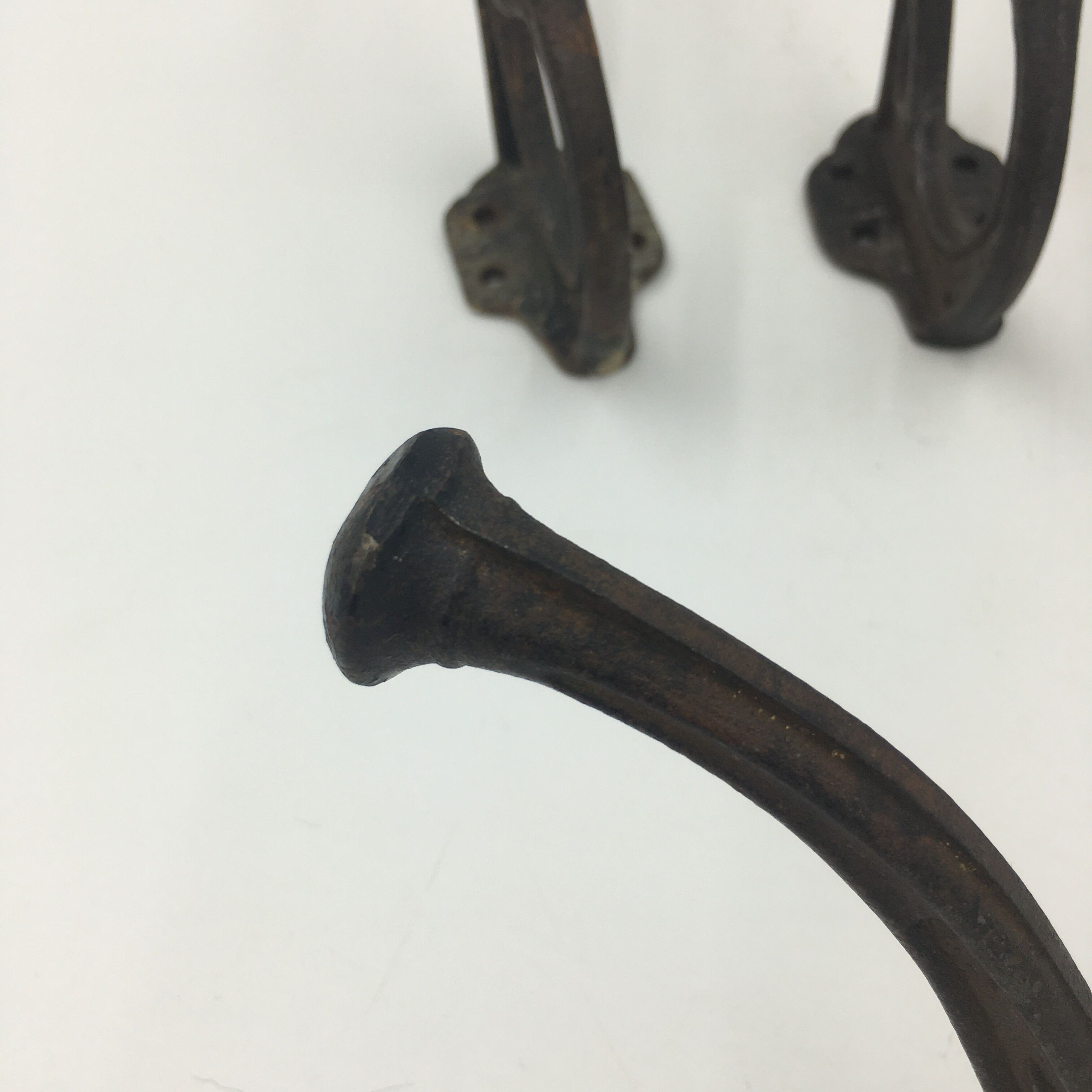 Set of 5 cast iron hooks early 20th