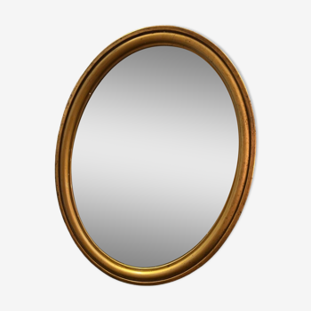 Ancien miroir ovale en bois doré du XX eme