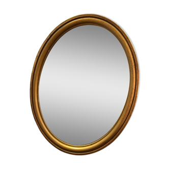 Ancien miroir ovale en bois doré du XX eme