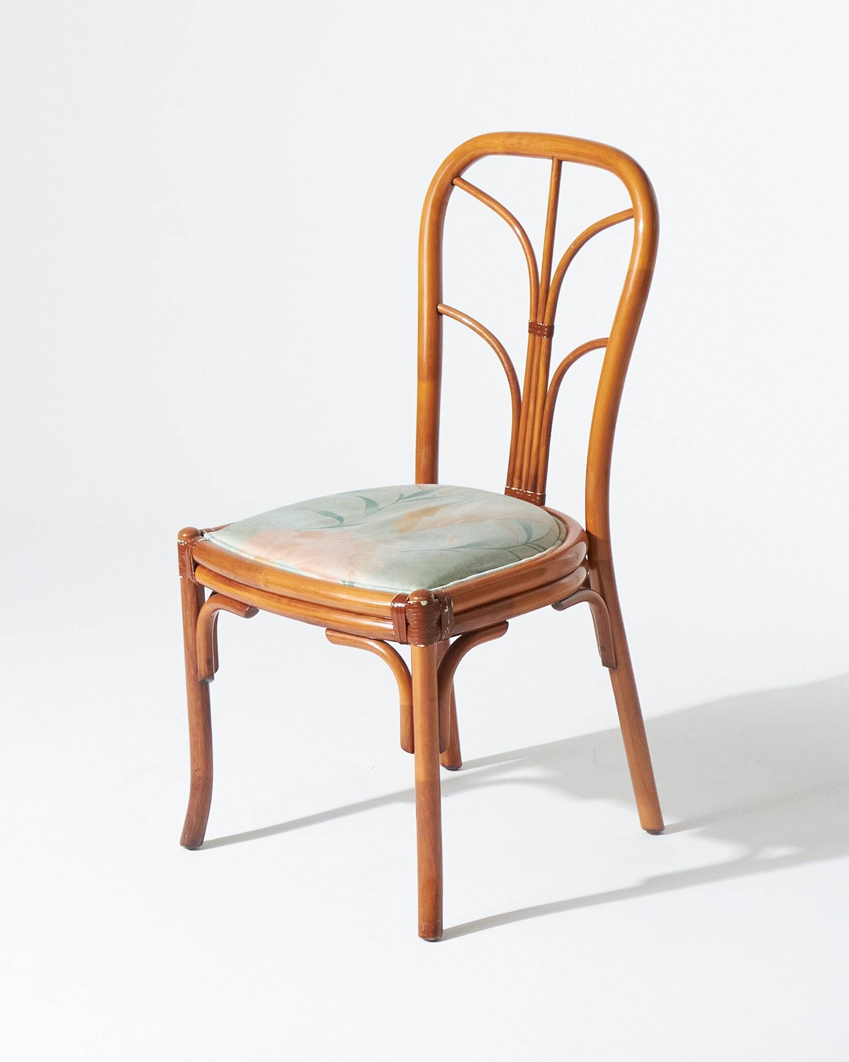 Pair of rattan and blue floral fabric chairs