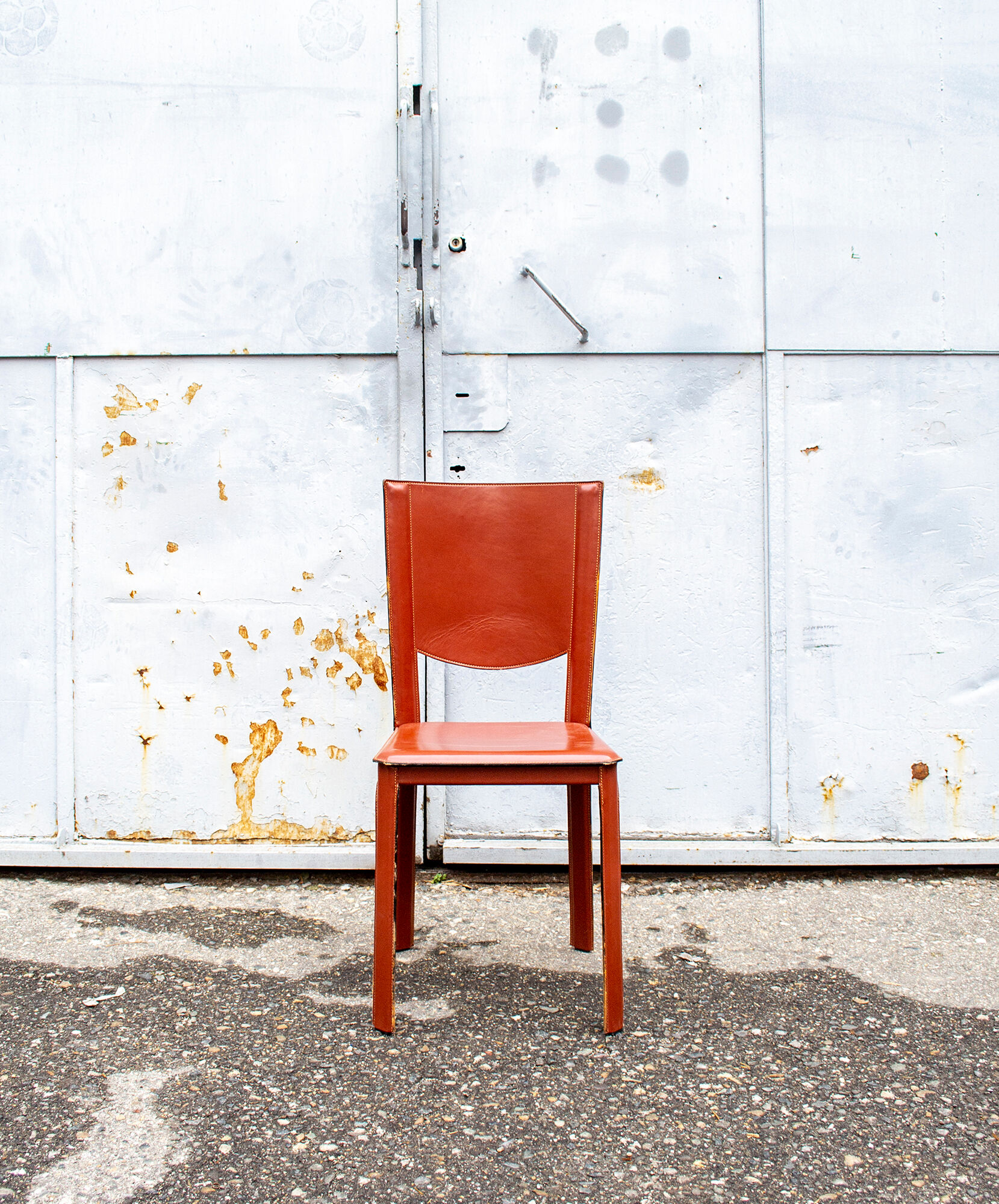 Set of four leather chairs by Enrico Pellizzoni 70s