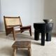 Black mango wood tripod side table with a semi-spherical top, height: 45 cm, diameter: 44 cm.