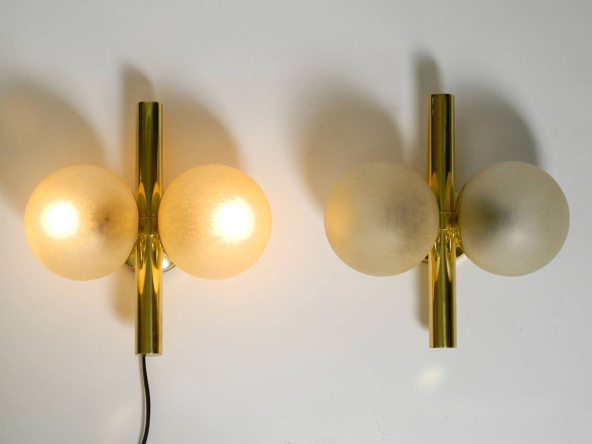 Pair of beautiful 60s Kaiser brass wall lamps with two golden glass spheres