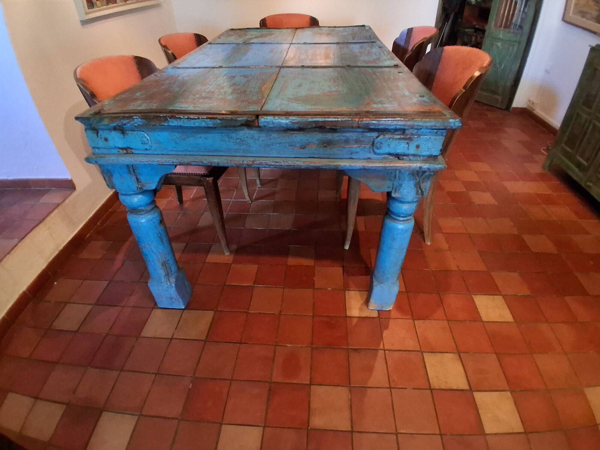 Large antique Indian dining table made of teak wood with patina.