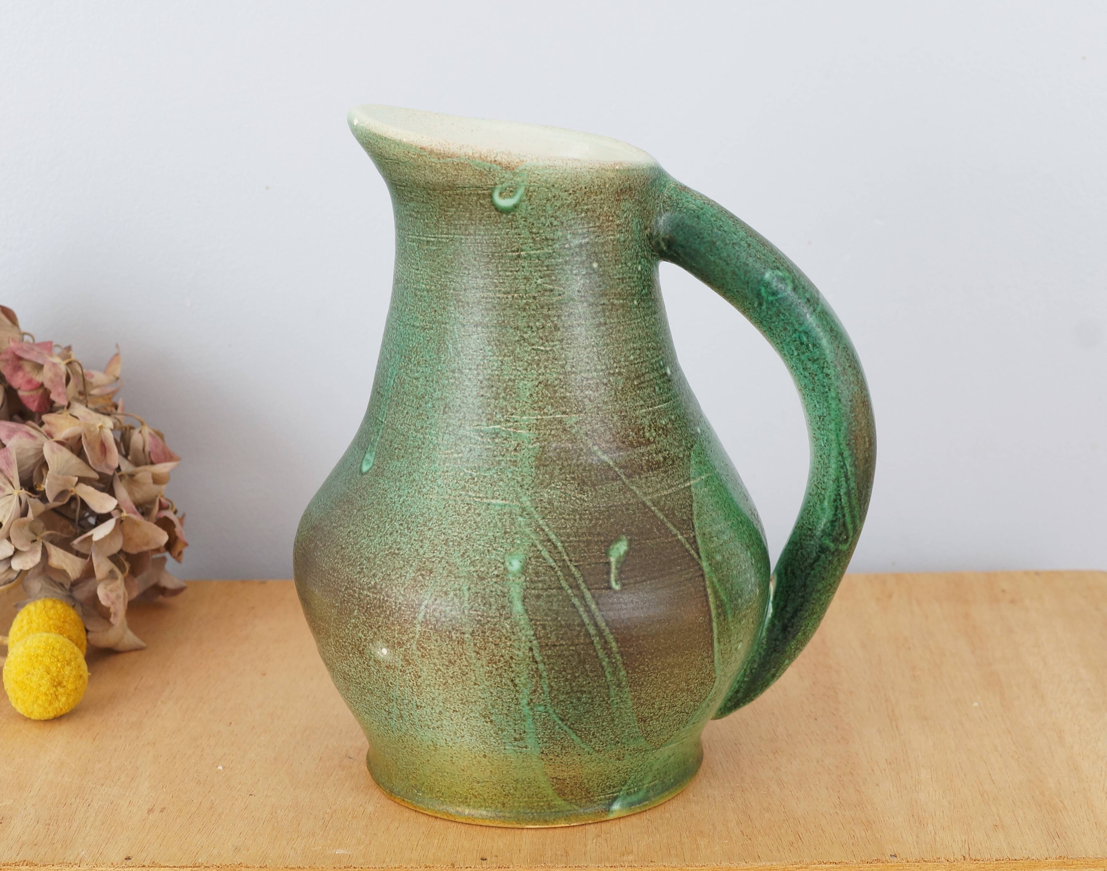 Ceramic jug enamelled in shades of green, signed, vintage