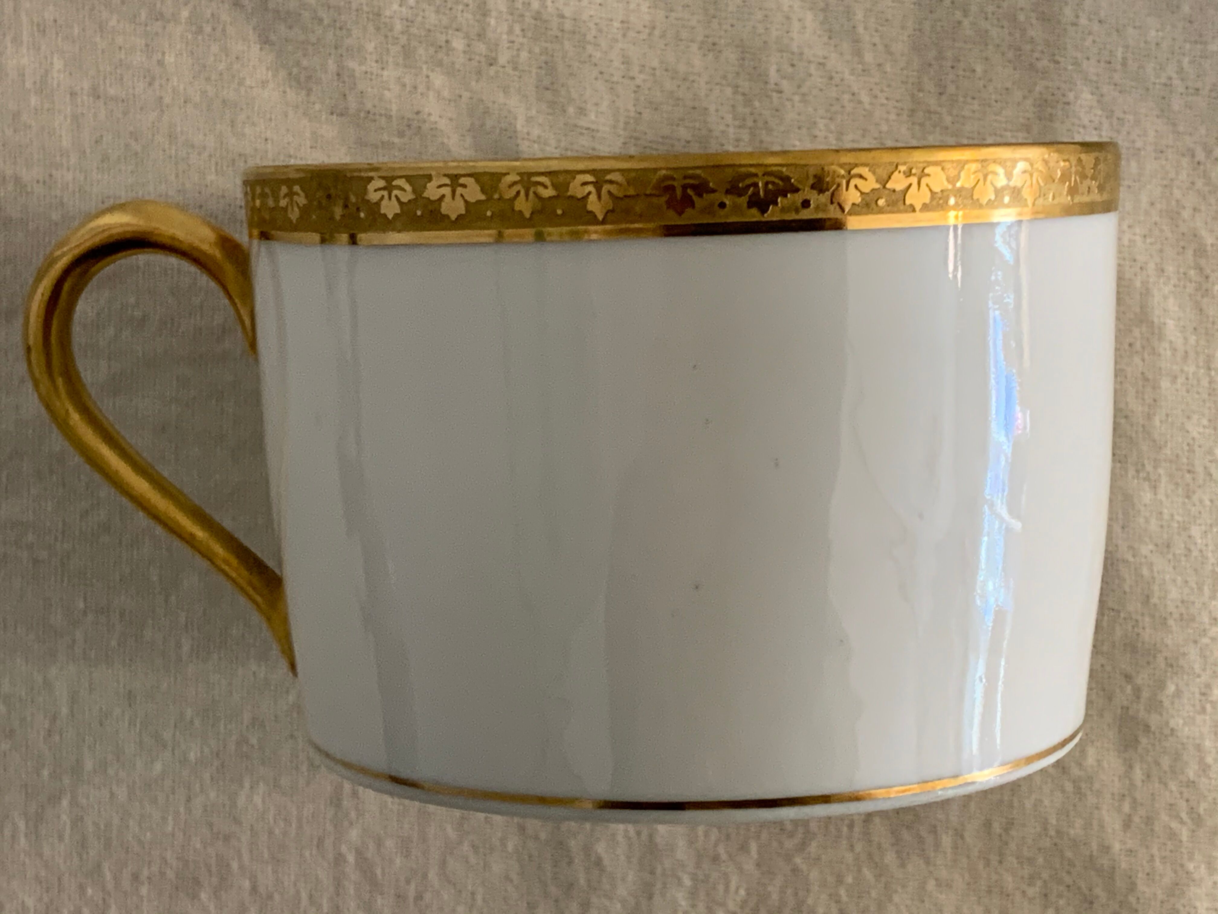 12 coffee cups and 12 white porcelain cups of Gold Gold Limoges