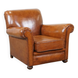 Fauteuil ancien en cuir de mouton couleur cognac