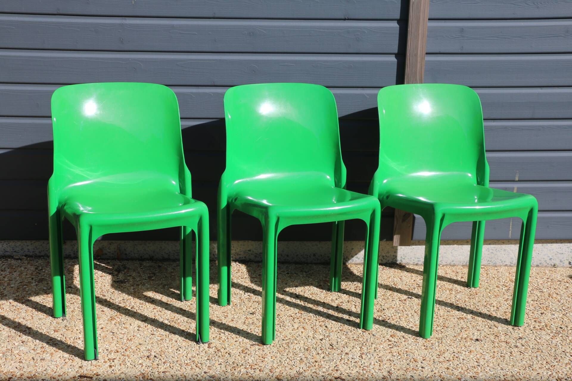 Set of 4 green Selene Magistretti chairs.