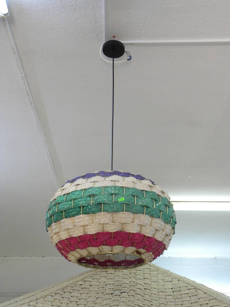 Handmade suspension in coloured woven natural plant fibres.