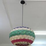 Handmade suspension in coloured woven natural plant fibres.
