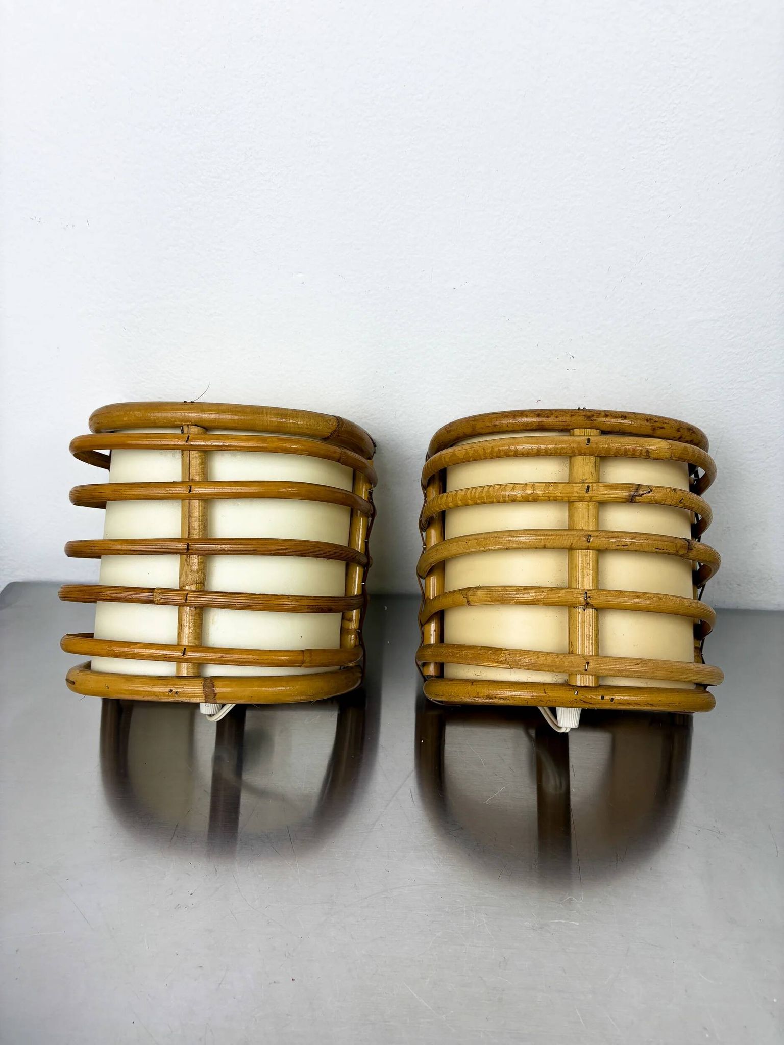 Pair of mid-century rattan wall sconces, 1960s, Italy