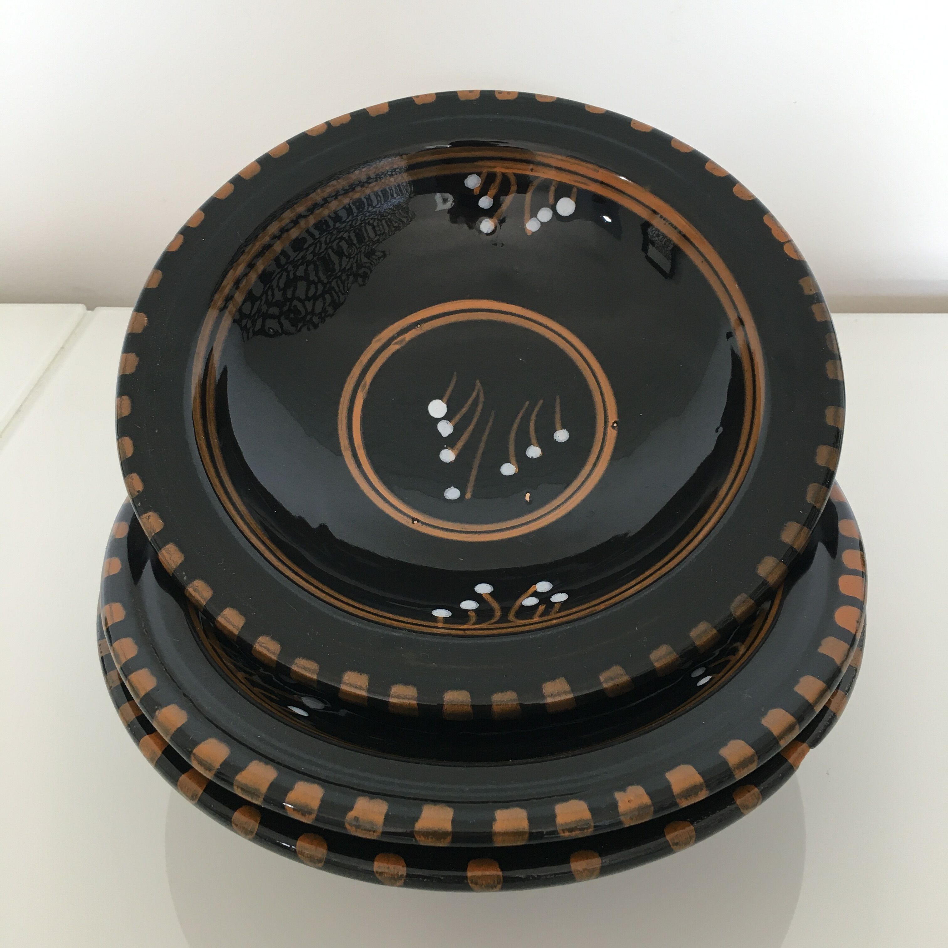 Set of 3 black decorative deep plates.