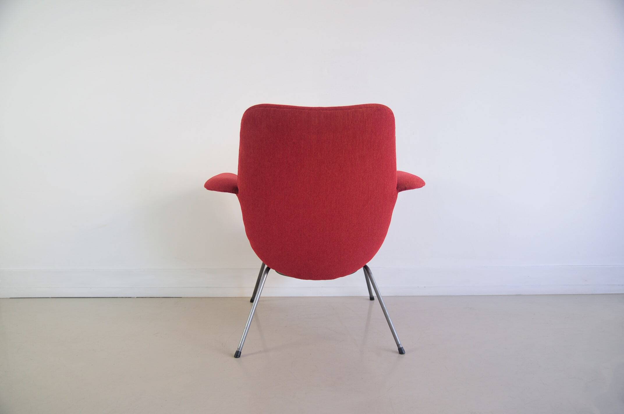 Red armchair with metal legs