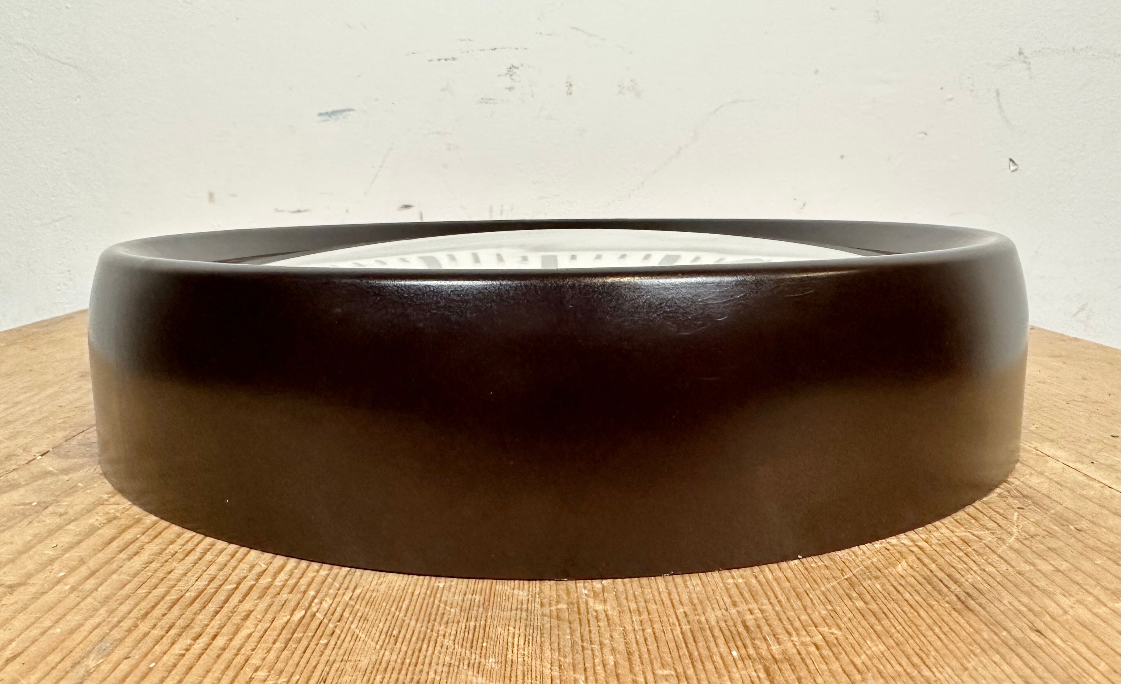 Industrial bakelite factory wall clock from Pragotron, 1960s