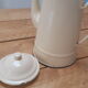 Cream metal teapot