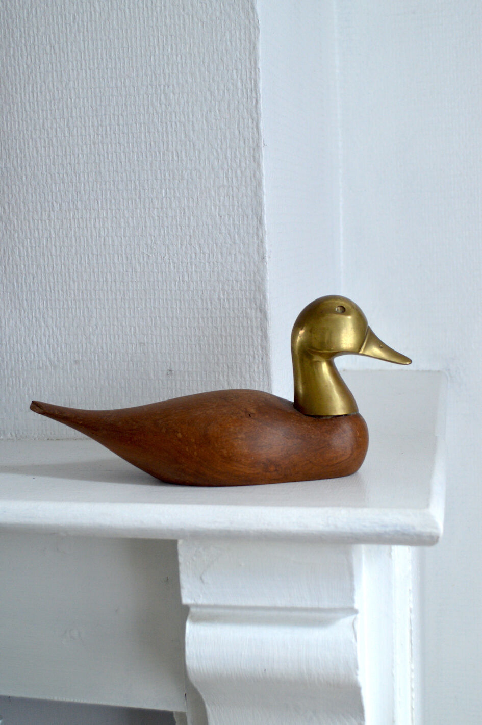 Wooden duck and brass