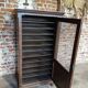 Antique printer's style wooden workshop furniture – mesh door