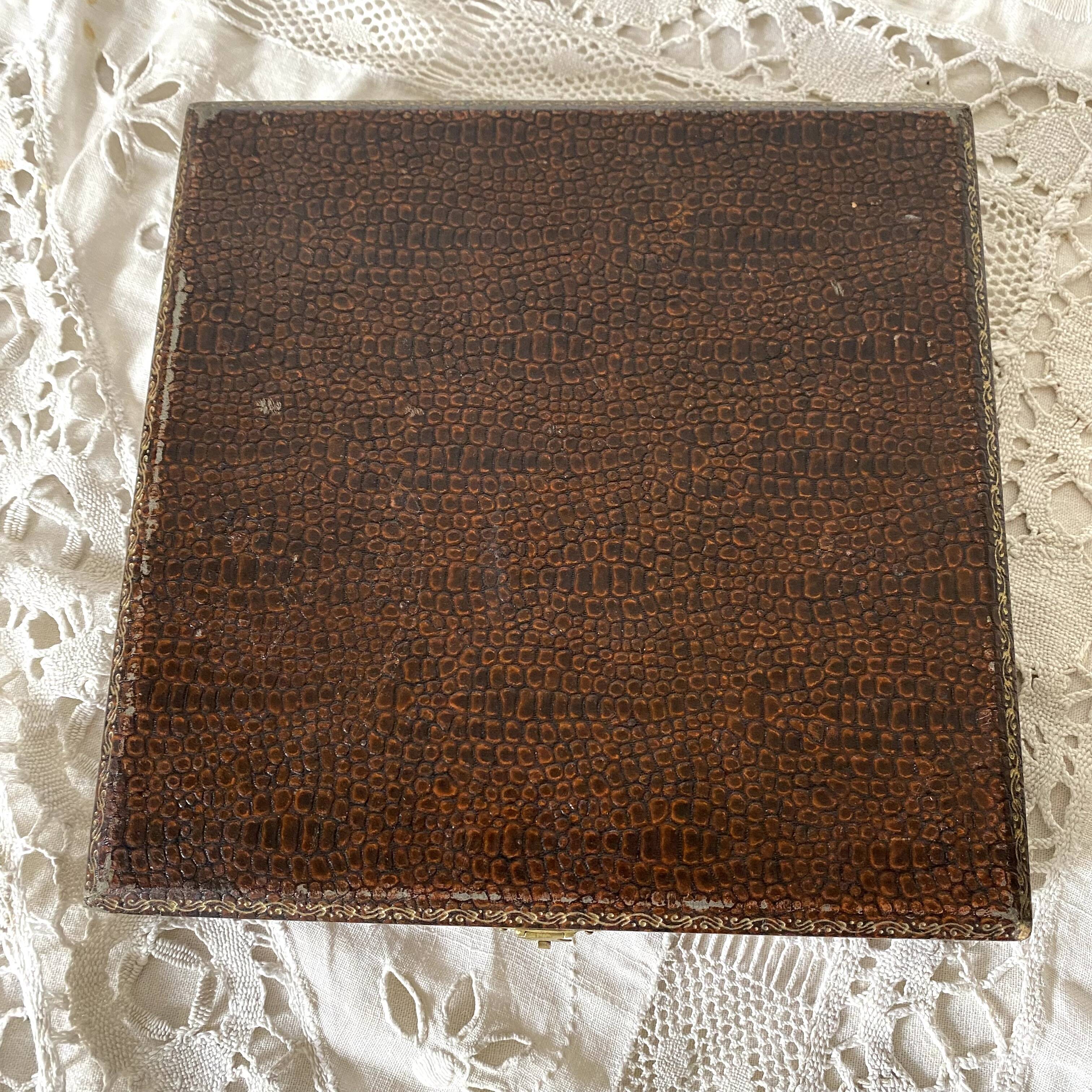 Antique dessert forks in brass and bakelite