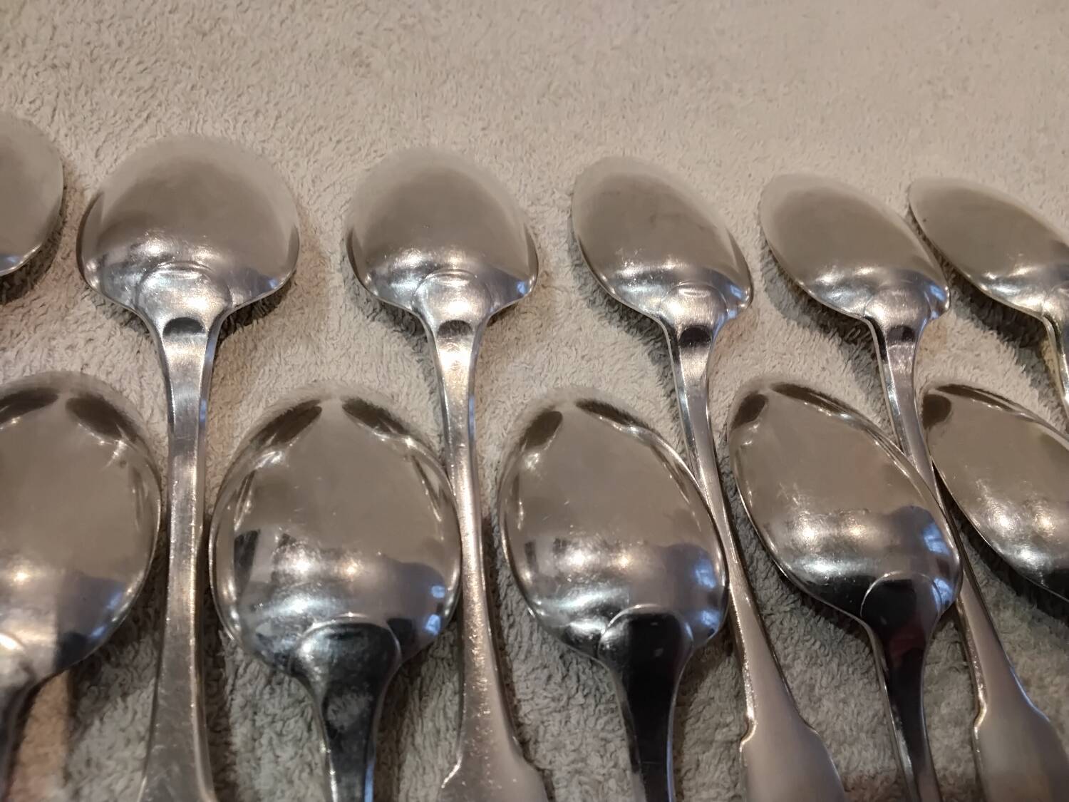 11 silver-plated dessert spoons by Christofle, Cluny pattern, striped