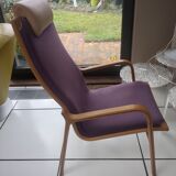 Relaxing armchair and its Scandinavian footrest