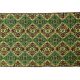 Green and yellow handmade rug with delicate colourful flowers