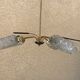 Brass and moulded glass chandelier, Bakelite arrow, 1950s, 5 lamps.