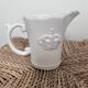 Small shabby white ceramic pitcher – crown motif