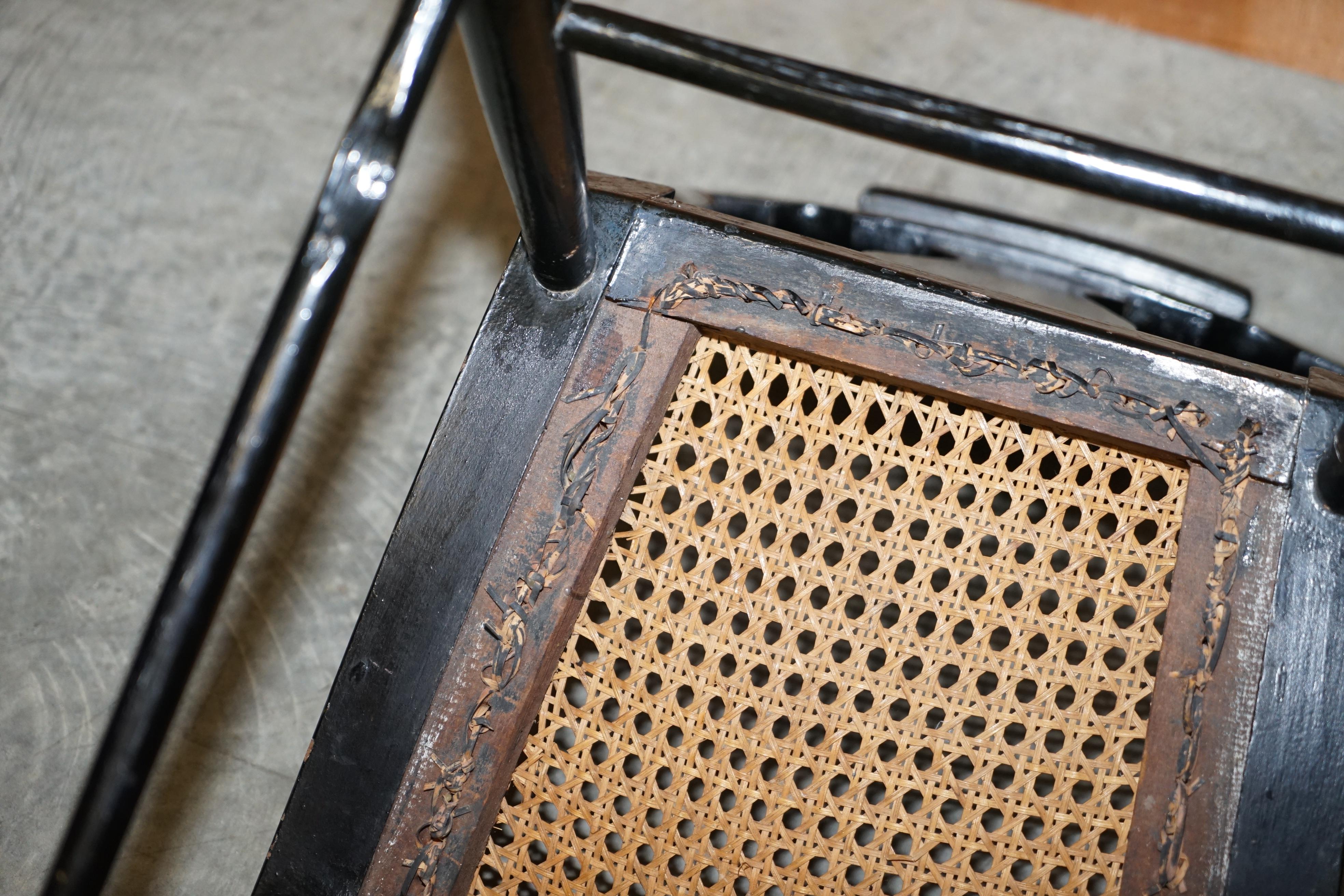 Georgian side bergère circa 1825, ebonised and hand-painted in Baltimore style.