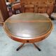 Round Regency dining table in mahogany and green leather with extensions - 20th century