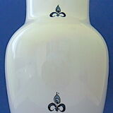 White-blue earthenware vase with stylized plant decoration