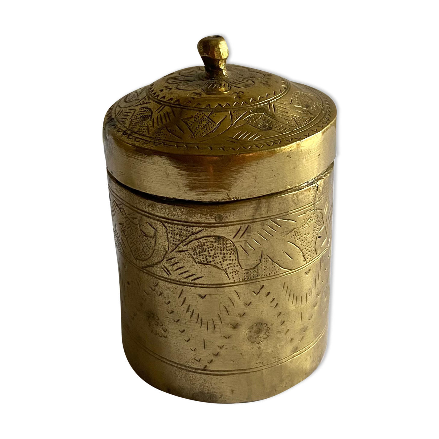 Old round box in chiseled brass
