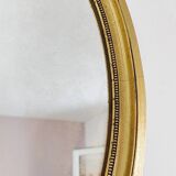 Antique gold oval mirror
