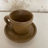 Set of stoneware coffee cups with saucers.