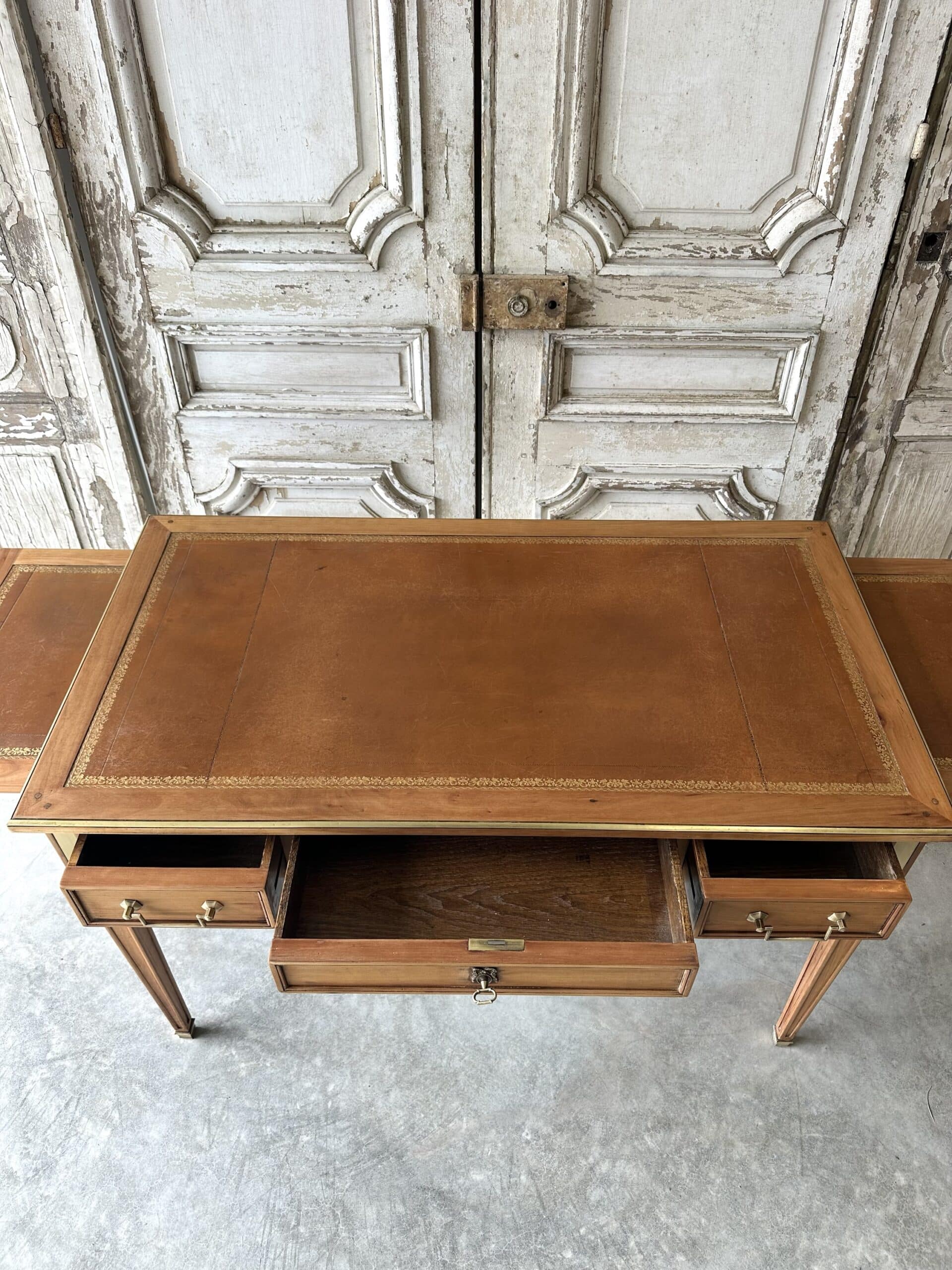 Directoire style flat desk circa 1960 in light cherry wood.