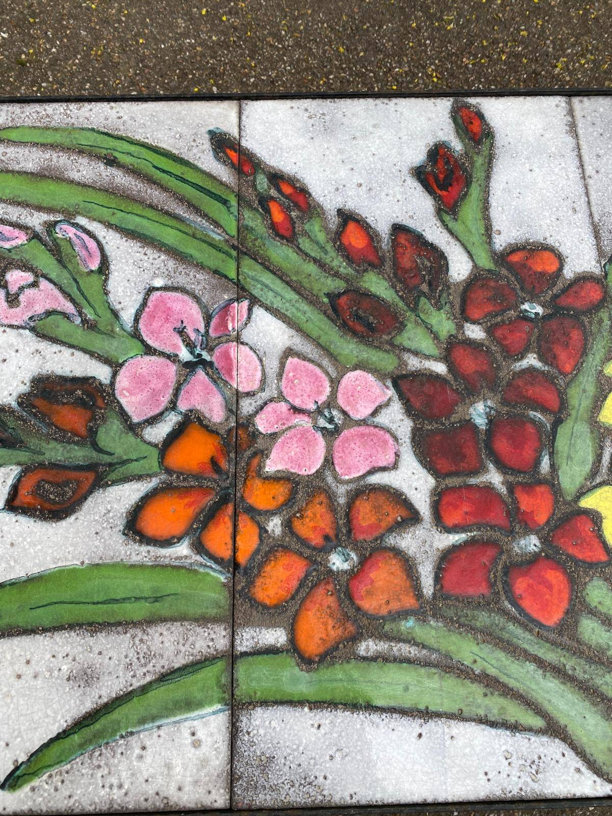 Vintage rectangular coffee table with ceramic inlaid flowers and steel.