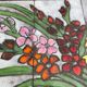 Vintage rectangular coffee table with ceramic inlaid flowers and steel.