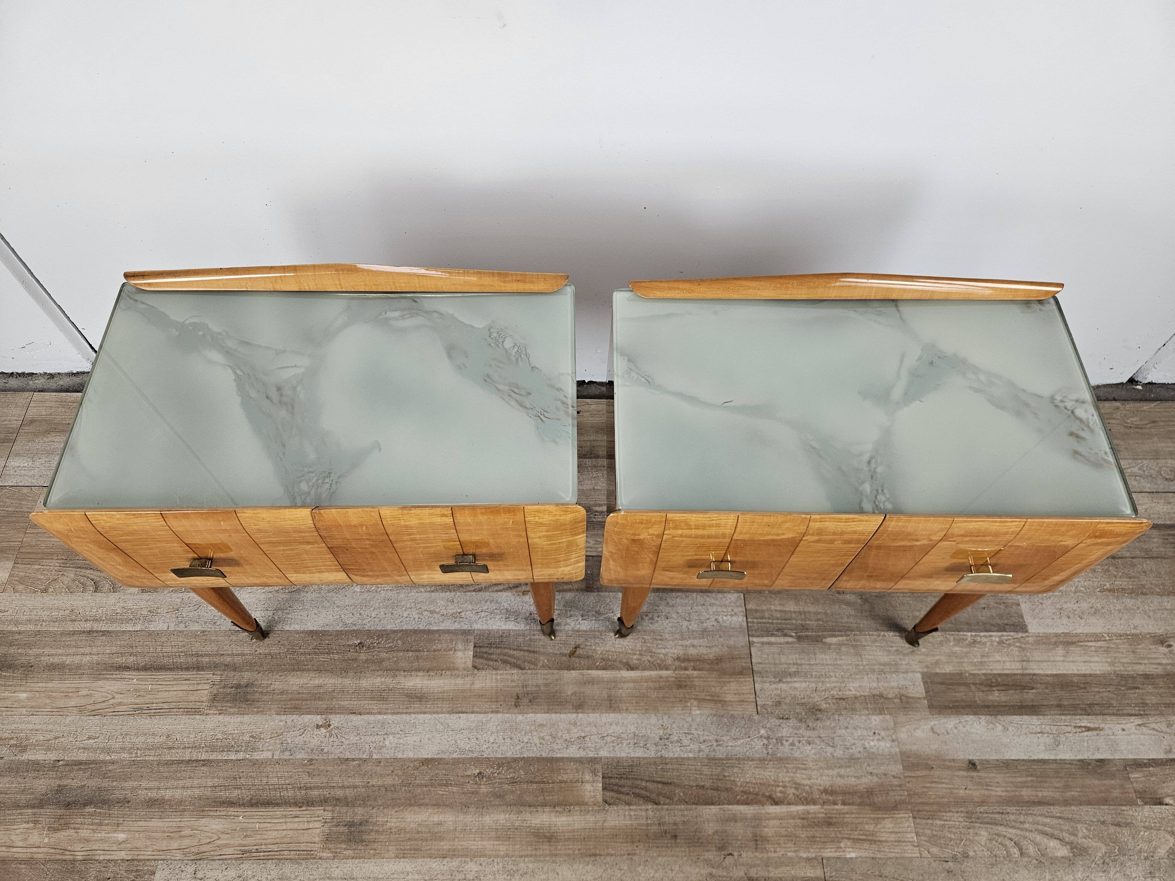 Mid-century nightstands in maple, brass, and glass