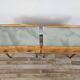 Mid-century nightstands in maple, brass, and glass