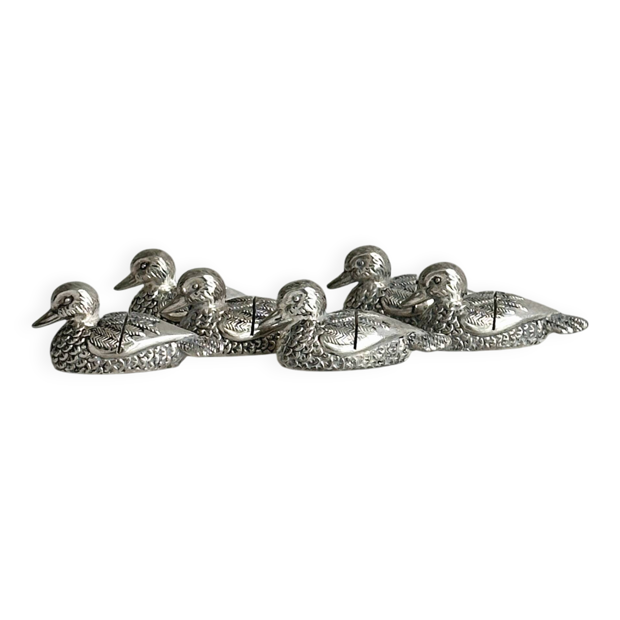 Set of 6 silver-plated metal ducks, name holders and knife rests.