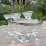 11 bottle-bottom bistro glasses with silver edging, early 20th century