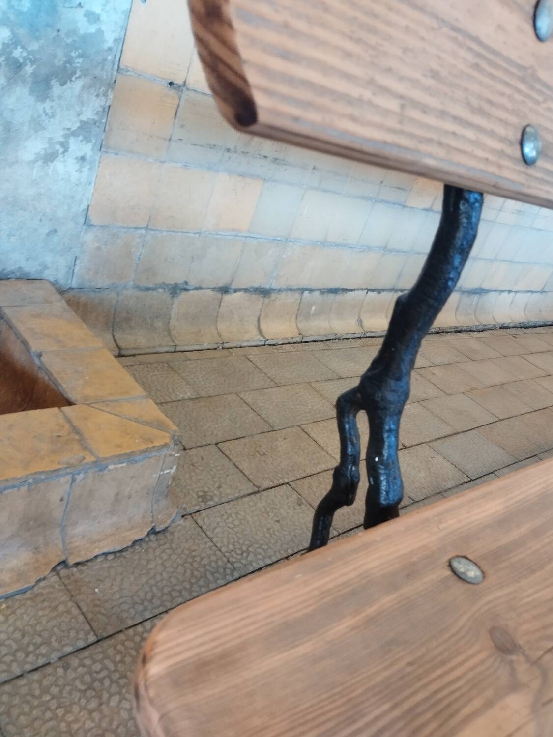 Antique garden bench with cast iron legs