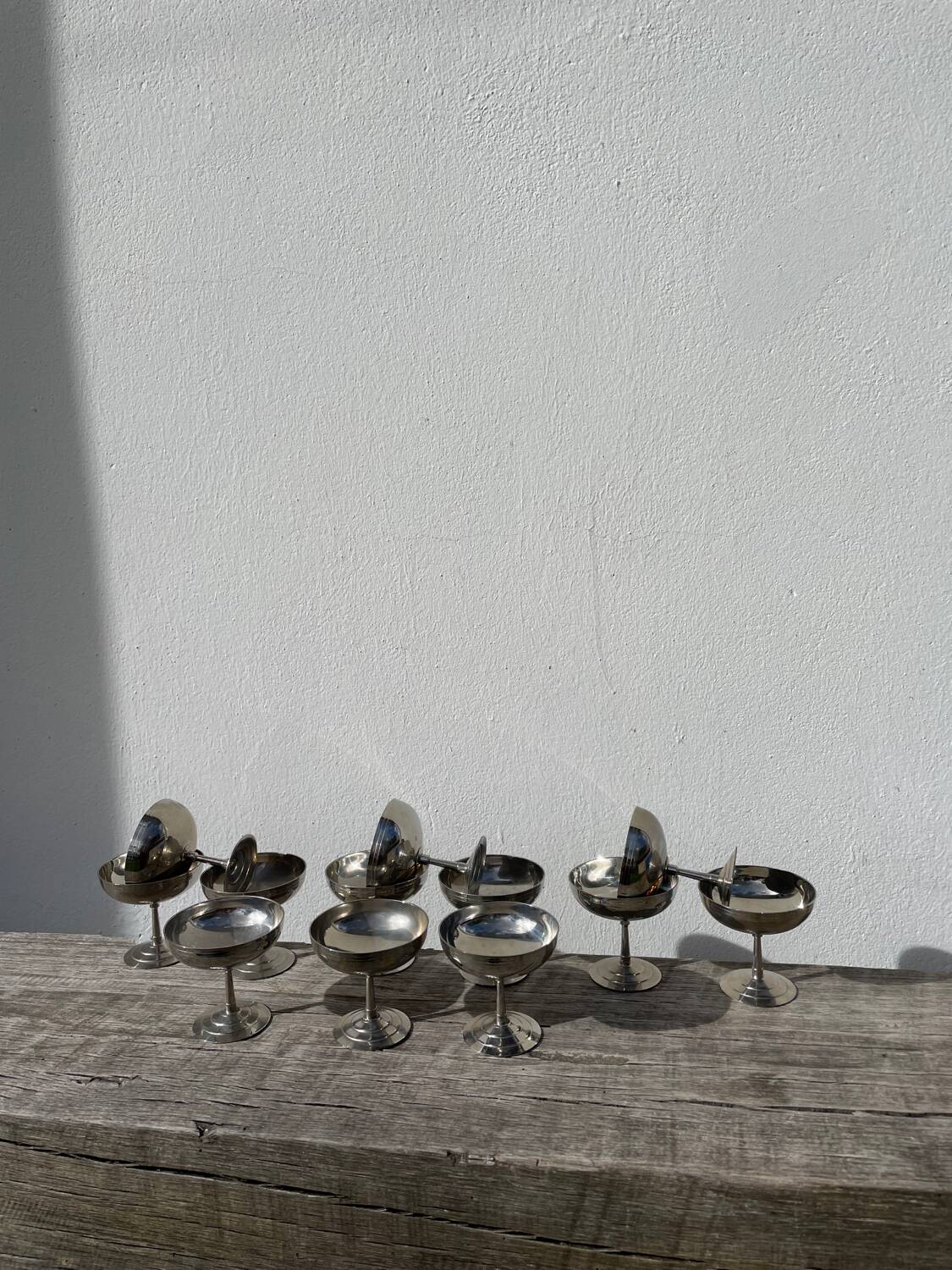 10 stainless steel cups signed Rémy Letang