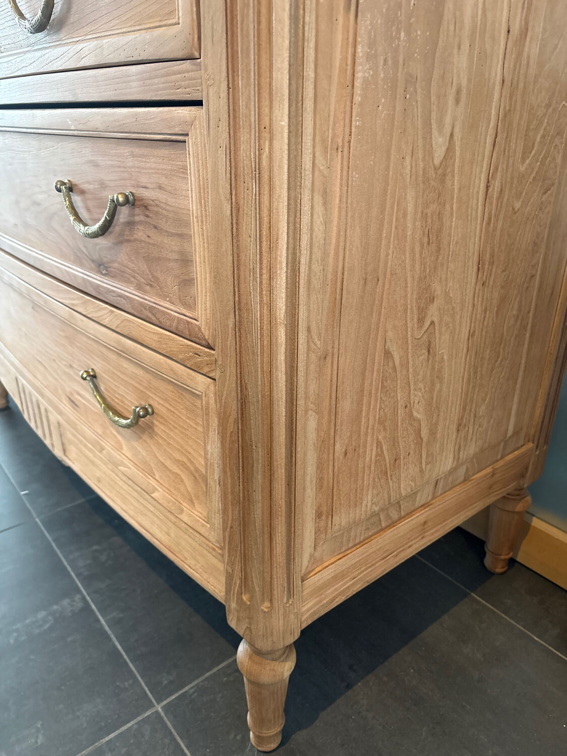 Cherry wood commode with a raw wood finish.