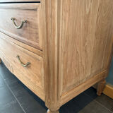 Cherry wood commode with a raw wood finish.