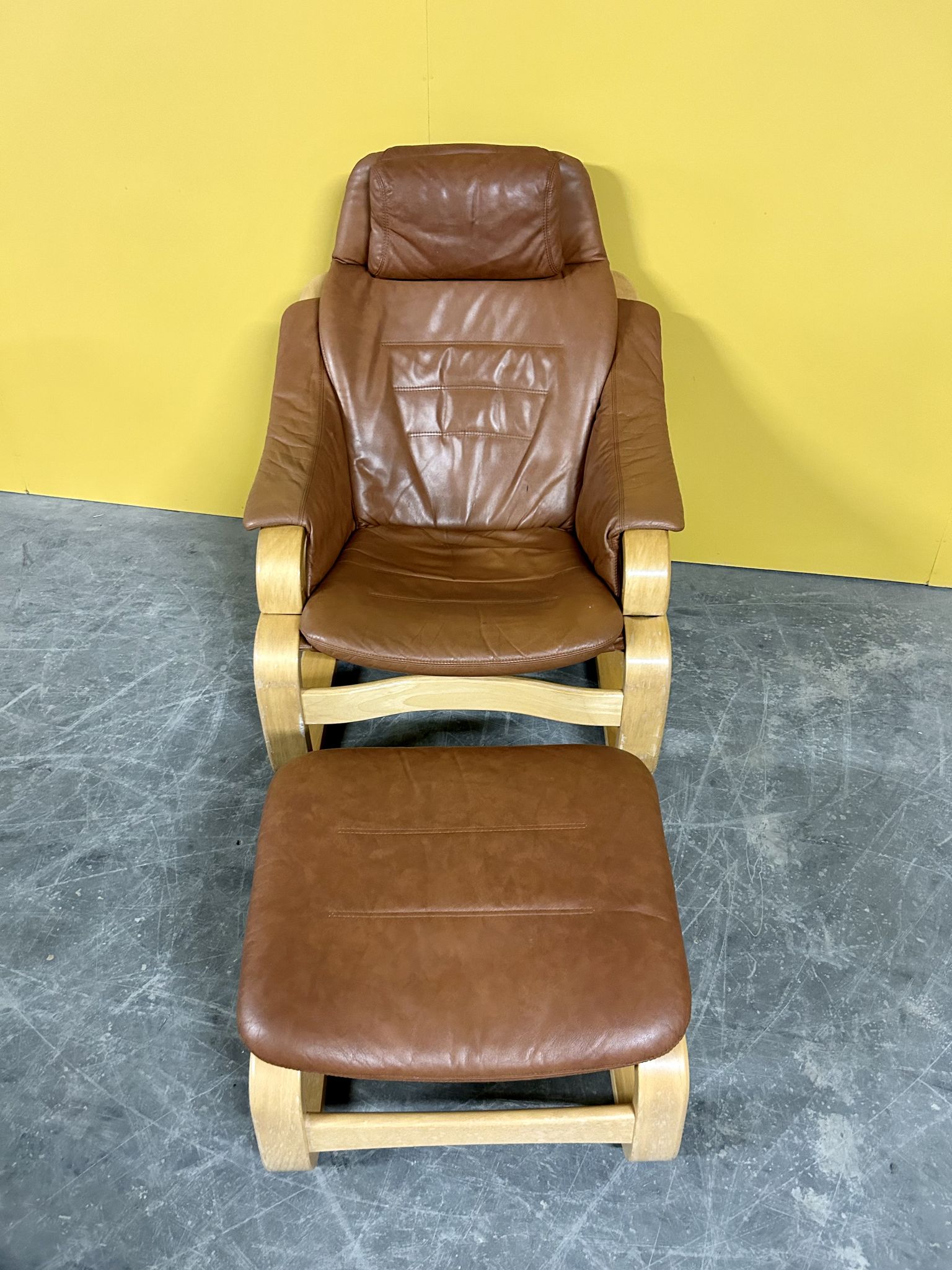 Danish vintage cognac leather armchair and footstool by Skipper Mobler