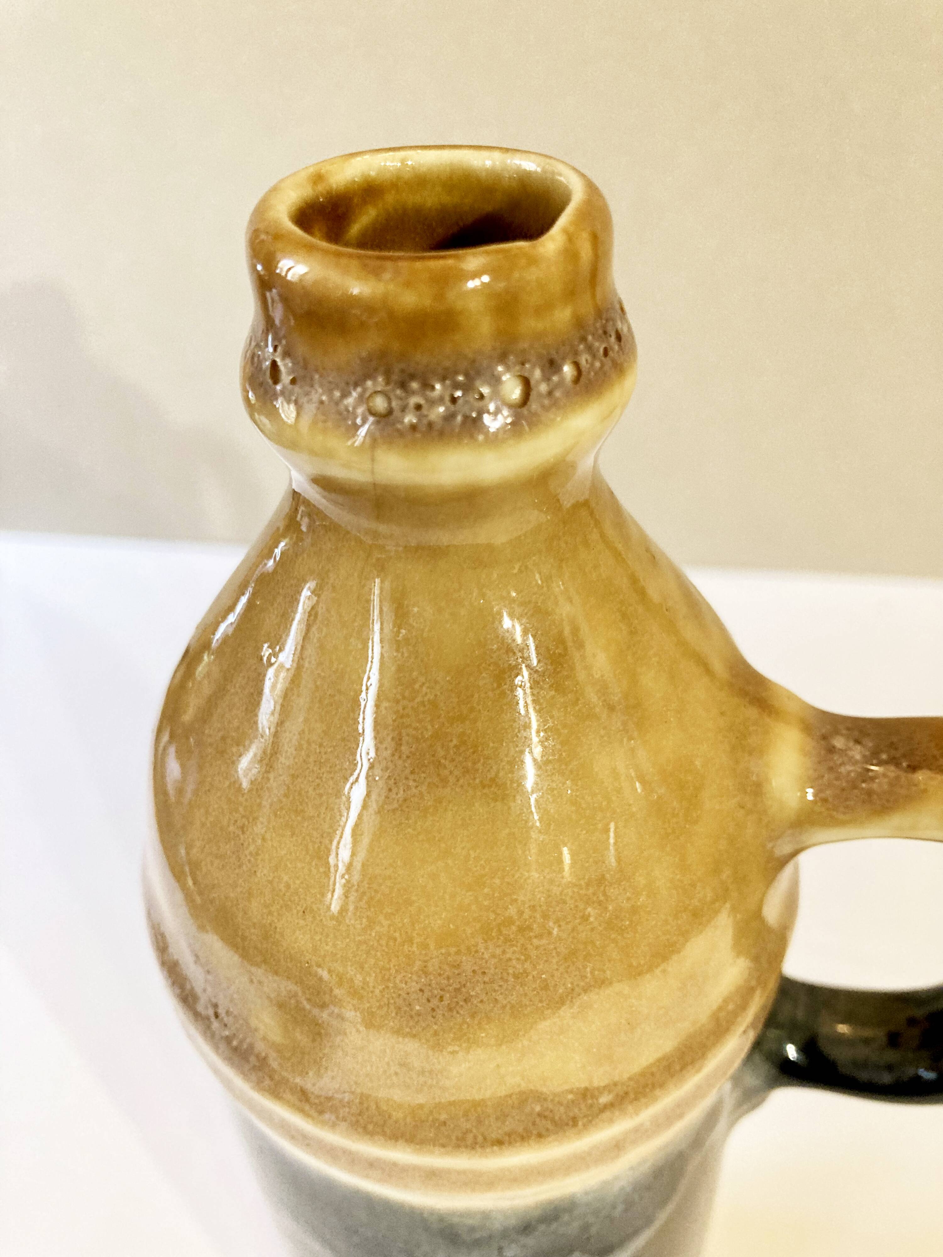 Enameled ceramic bottle with handle