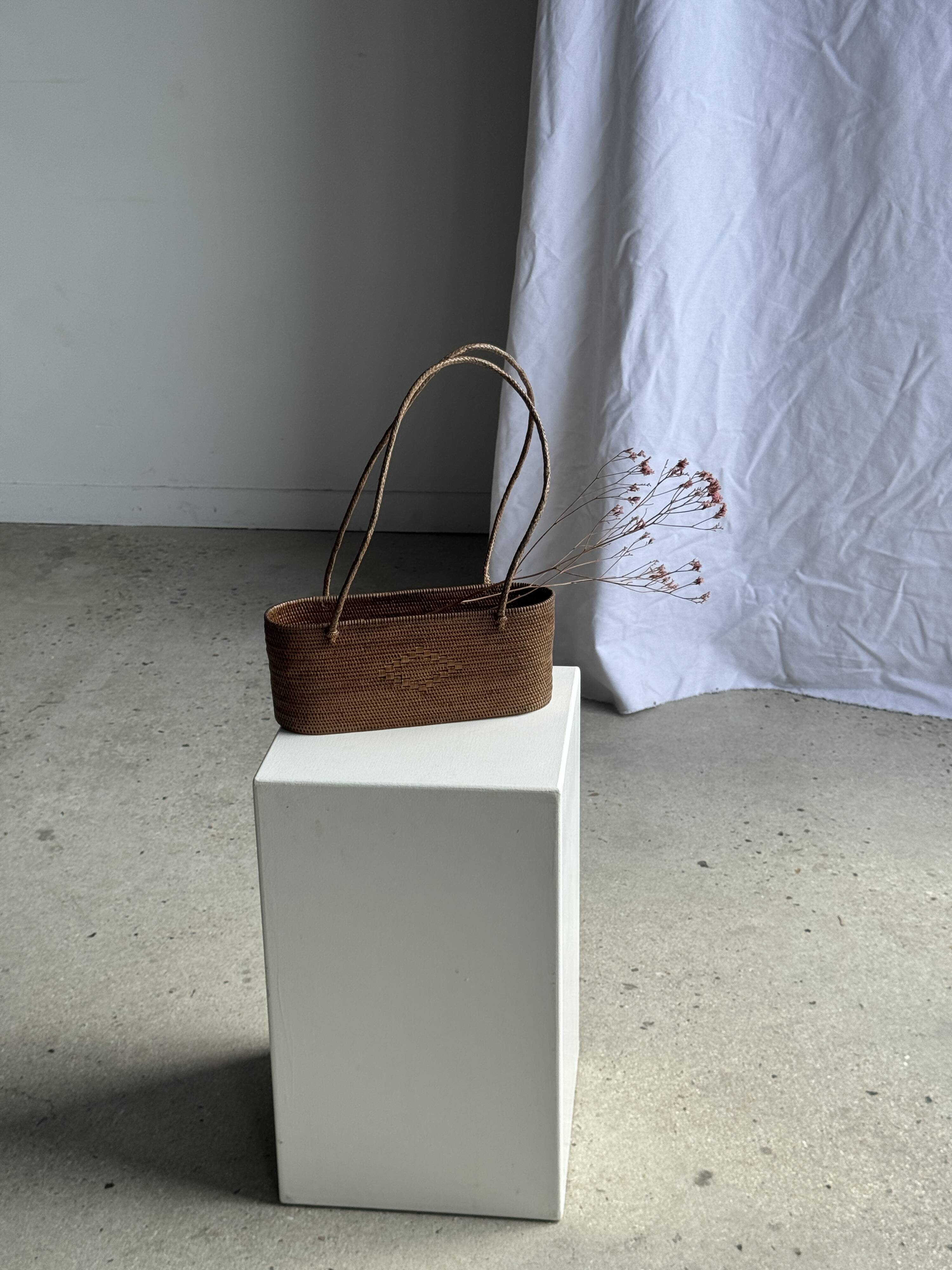 Small oval basket with long handles, traditional Indonesian L28xH10