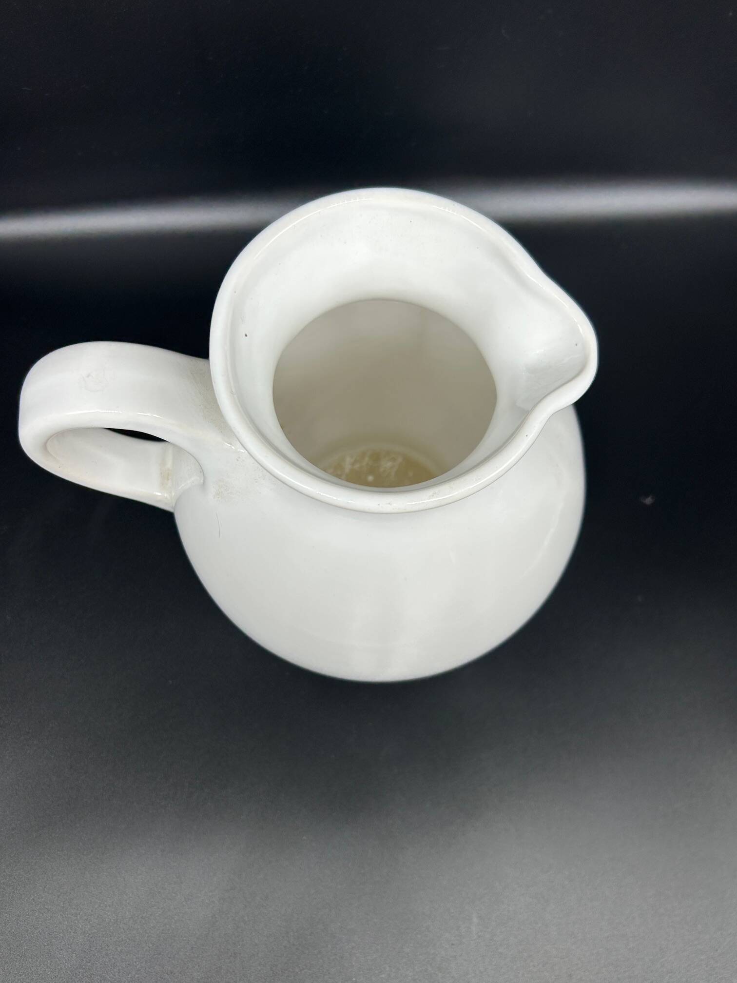 white ceramic cherry jug