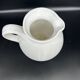white ceramic cherry jug